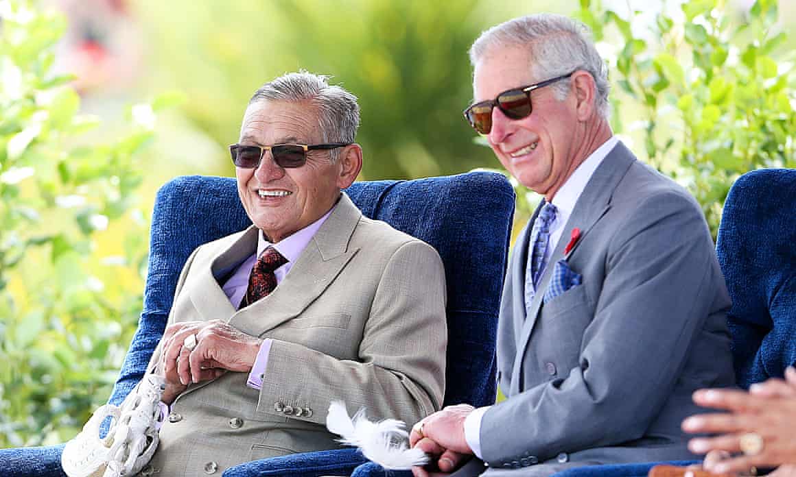 King Charles and Kingi Tuheitia, both smiling and wearing sunglasses, look on during a visit to Turangawaewae Marae in November 2015 in Ngaruawahia, New Zealand