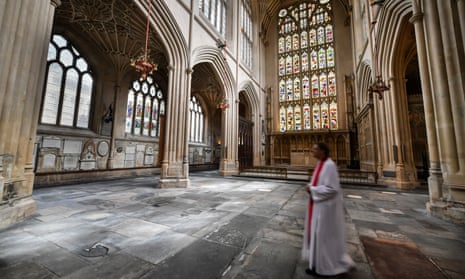 Canon Guy Bridgewater walks across the completed floor in the East Wing of Bath Abbey