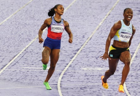 The USA’s Sha’Carri Richardson crosses the line behind Julien Alfred of Saint Lucia in the women’s 100m final.