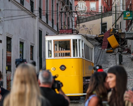 Journalists at the site of the Gloria funicular crash on Thursday.
