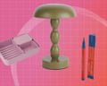 A mushroom-shaped lamp, pink organiser tray, and red pen with box sit together