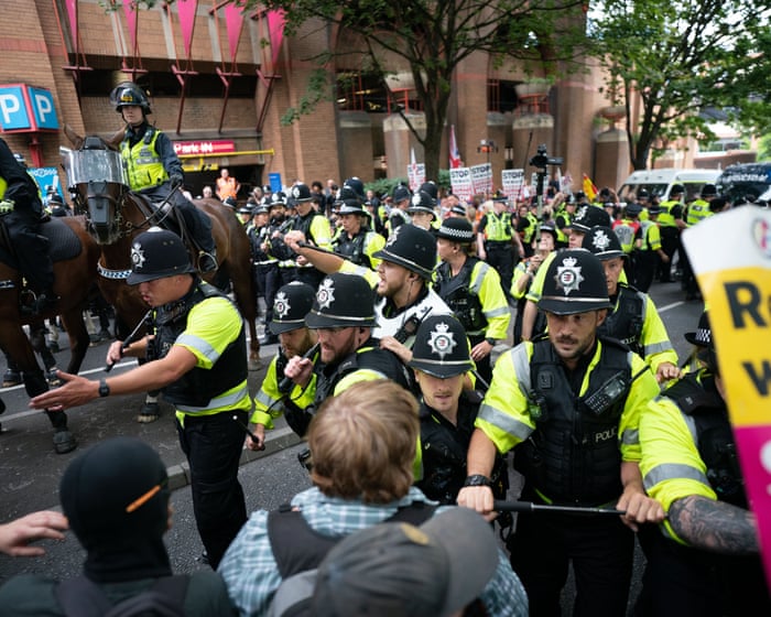 Police clash with protesters at asylum hotel demonstrations across UK
