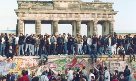 Bringing the haus down: a protest on top of the wall on the eve of its demolition.