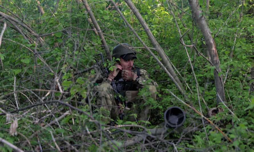 A Ukrainian serviceman in a wooded area in an undisclosed part of the Kharkiv region on Tuesday.