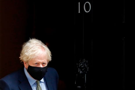 Britain’s Prime Minister Boris Johnson wearing a face mask or covering due to the COVID-19 pandemic, leaves number 10 Downing Street in central London.