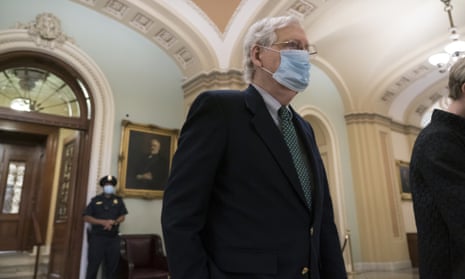 Mitch McConnell leaves the chamber after a procedural vote to advance the confirmation of Amy Coney Barrett to the supreme court.