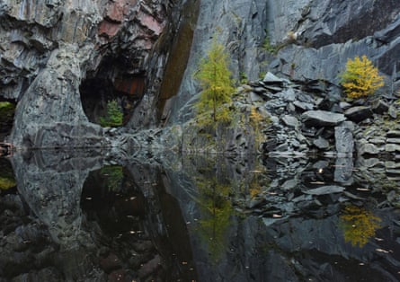 Hodge Close slate quarry reflected in its still, dark lake