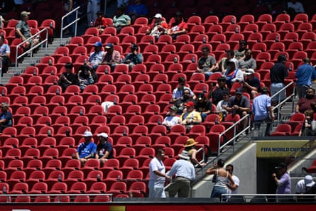 Fans watch Qatar v Switzerland surrounded by empty seats