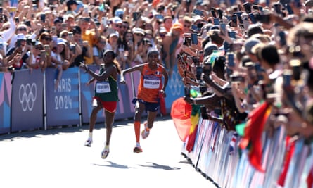 Tigst Assefa and Sifan Hassan of Team collide during the closing stages of the women’s marathon.