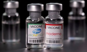 Pfizer-BioNTech and Moderna Covid-19 vaccine bottles.
