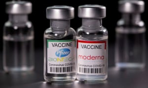 Pfizer-BioNTech and Moderna Covid-19 vaccine bottles.