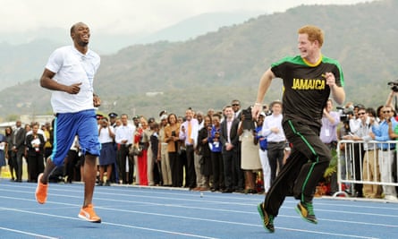 Prince Harry larks about with Olympic sprint champion Usain Bolt at the University of the West Indies in Jamaica, 2012.