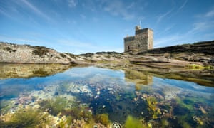 Portencross Castle reflected in a small rock pool