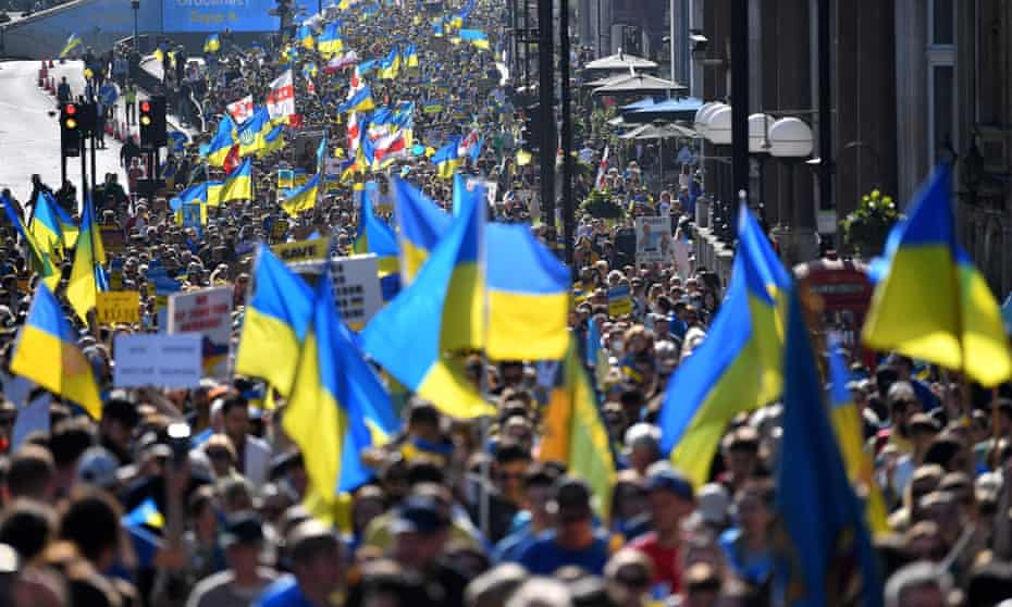 Demonstrators wave Ukrainian national flags during the London stands with Ukraine protest march.