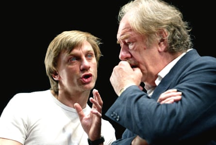 Craig speaking emotionally and earnestly, Gambon thoughtful and listening