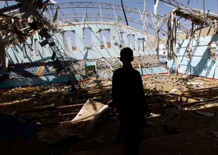 A Yemeni boy inspect the damage at a sports hall in Sana’a