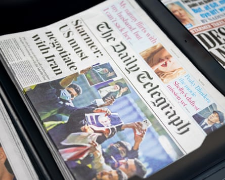 A copy of the Telegraph on a shelf.