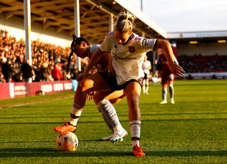 Alessia Russo in action with Maz Pacheco of Aston Villa.