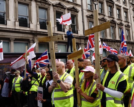 Among the crowd at Unite the Kingdom rally in London in September 2025, some people carried wooden crosses.