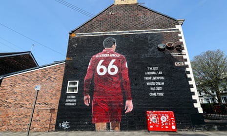 Large mural of Trent Alexander-Arnold on the wall of a house, with his back turned to show his number, 66, on his all-red strip, and the words 'I'm just a normal lad from Liverpool whose dream jst came true'