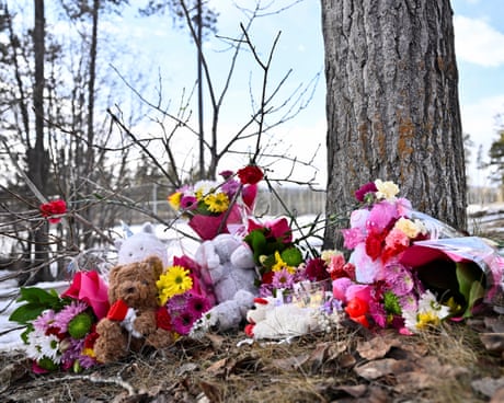 Flowers and toys lie on the ground near the site of a mass shooting at a high school, in the town of Tumber Ridge, British Columbia, Canada.