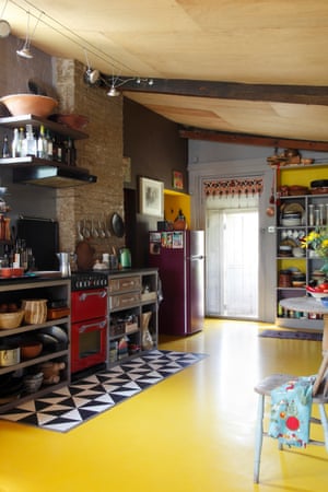 plywood ceilings and yellow rubber flooring in the kitchen