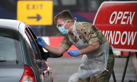A member of the armed forces carrying out coronavirus testing at Glasgow airport, 29 April 2020