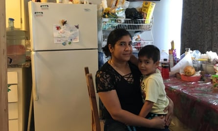 Dora Diaz and her son Gael in their apartment. They haven’t yet faced eviction but fear it is coming.