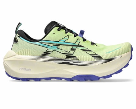 An Asics TRABUCO MAX 4 trainer. It is light bright green with black and turquoise Asics branding and a cream and lilac sole.
