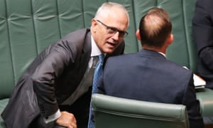 Malcolm Turnbull speaking with Tony Abbott during question time.