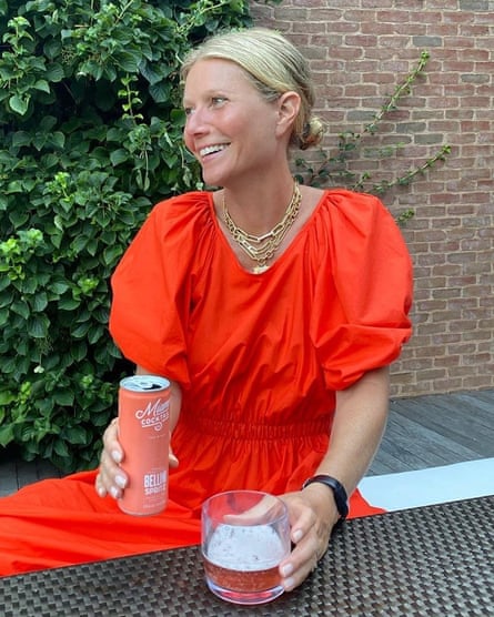 Gwyneth Paltrow at home in a ketchup-red sundress.