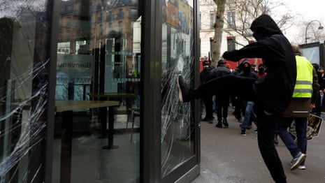 Protesters smash shopfronts in central Paris over pensions reforms – video