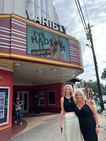 Two women in front of a theater