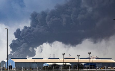 Black smoke billowing out of a port building