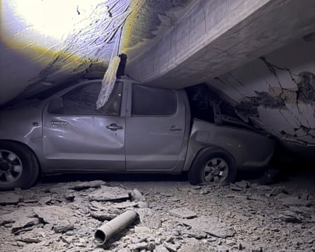 A car under the rubble of a building in the aftermath of earthquakes, in Caraballeda, La Guaira state.