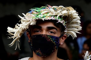 An Indian supporter of the lesbian, gay, bisexual, transgender (LGBT) community wearing a pollution masks takes part in a pride parade in New Delhi