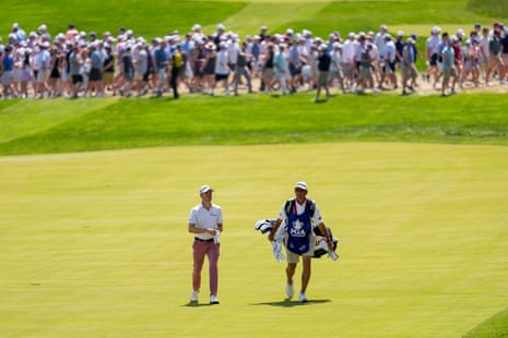 Justin Thomas walks up the 18th fairway.