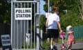A voter and a child arrive to a polling station in Hillingdon during a by-election in the northwest London constituency of Uxbridge and South Ruislip on 20 July, 2023.