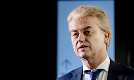 Geert Wilders pictured in close-up with an illuminated blue sign behind his head and black background