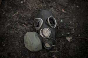 A damaged gas mask lies on the pavement outside Kyiv, Ukraine.