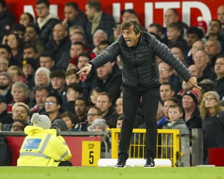 Antonio Conte gestures emphatically while managing Tottenham away to Manchester United.