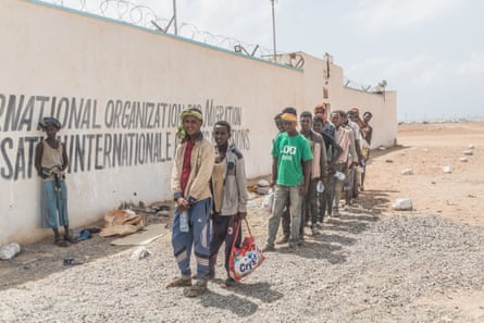 People queue to register at the IOM transit centre in Obock, where voluntary returns to Ethiopia are organised