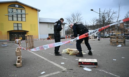 French municipal police officers collect evidence in a car park in Mulhouse French municipal police officers collect evidence in a car park in Mulhouse