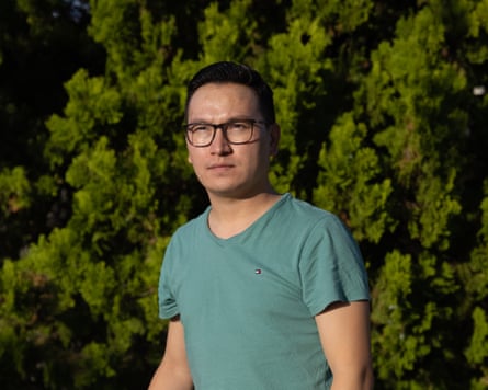 Zaki Haidari wearing glasses and a green T-shirt