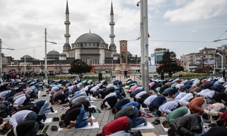 Worshippers attend Friday prayers outside the newly completed Taksim mosque during the opening ceremony at Taksim Square