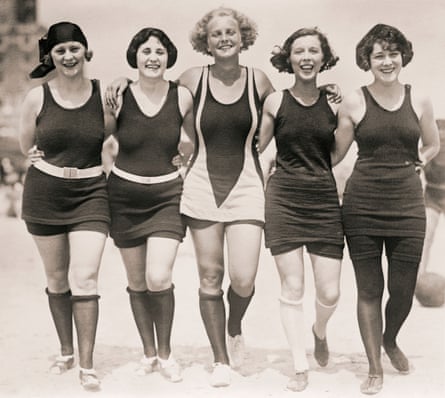 Five women from the 1920s in bathing costumes that only revealed their shoulders and their legs.