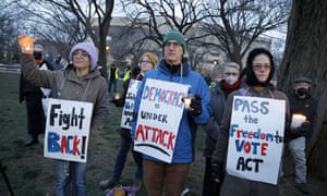 Photo by Paul Morigi. Activists attend a "Defend Democracy" vigil near the U.S. Capitol to commemorate the one-year the anniversary of the January 6th attack on the U.S. Capitol on January 6, 2022 in Washington.