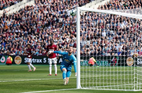 Manchester United’s David de Gea looks on as West Ham’s Andriy Yarmolenko scores their second goal.
