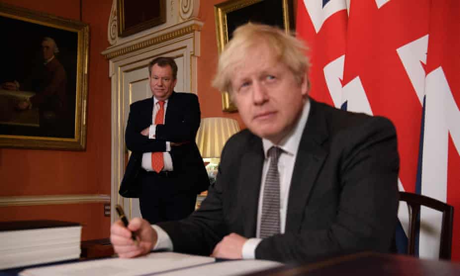 David Frost, left, and Boris Johnson signing the Brexit trade deal, 30 December 2020.
