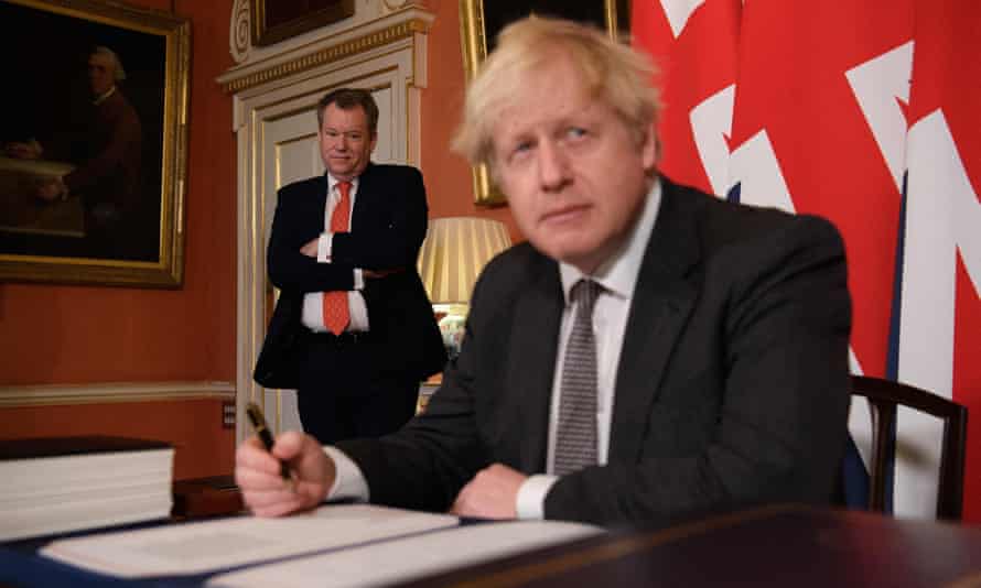 Negotiator David Frost looking on as Boris Johnson signed the UK-EU trade deal in December 2020.